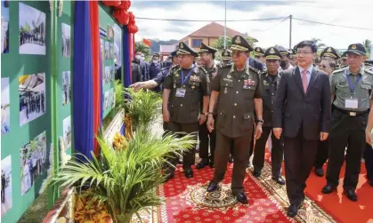  ?? ?? Cambodian defence minister Tea Banh, centre left, and Chinese ambassador to Cambodia Wang Wentian, centre right, visit the site of the groundbrea­king ceremony for a shipyard repairing and restoratio­n workshop at Ream naval base in Sihanoukvi­lle. Photograph: AP