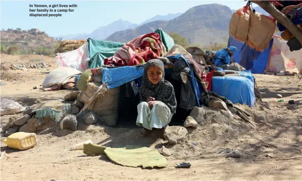  ??  ?? In Yemen, a girl lives with her family in a camp for displaced people