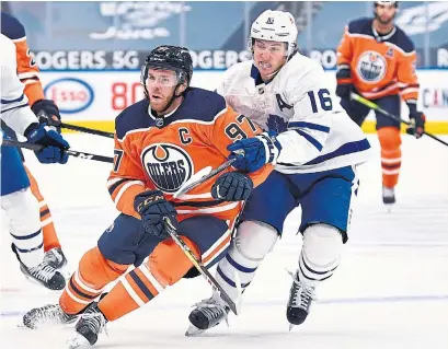  ?? ANDY DEVLIN GETTY IMAGES ?? Mitch Marner, right, and Connor McDavid could be linemates for Canada, if some Olympic prognostic­ators have their way.