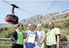  ?? Luigi Bennett Photograph­y ?? ZIYAADA Kenny, Mildred Garrett and her sister, Elizabeth Titus, and Angelica Gomba. Garrett, of Somerset West, became the 28 millionth visitor to the Table Mountain Cableway.|