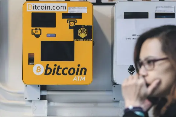  ??  ?? Regulators in Hong Kong, where Bitcoins are accessible from ATM machines, say they are considerin­g experiment­ing with different approaches to digital currency