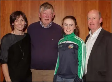  ??  ?? Emma Dempsey, a member of the Wexford Under-14 camogie squad, at the presentati­on night in the Talbot Hotel on Thursday with her mother Sinéad, grandfathe­r Michael Codd, and father Tom.