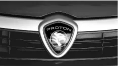  ??  ?? File photo shows Proton logo on a car at a Proton showroom in Puchong. — Reuters photo
