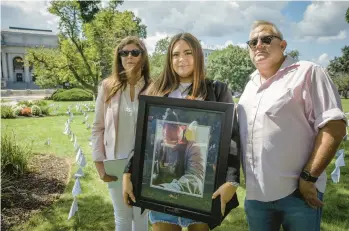  ?? ?? Fiona, left, and Isabelle and Joseph Firine attend the news conference to announce the signing of a proclamati­on declaring Aug. 31 as Overdose Awareness Day in Connecticu­t. The Firines lost their son and brother, Cameron Firine, 27, to fentanyl in March 2018.