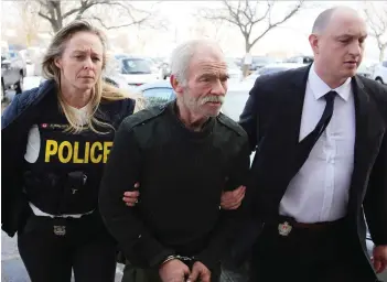 ?? ELLIOT FERGUSON ?? Police escort Michael Wentworth, 65, of Kingston into court for a bail hearing on Friday. He is charged with nine crimes, including three counts of first-degree murder dating back to the mid-1990s.