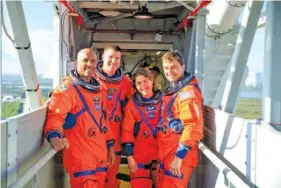  ?? FILE PHOTO BY NASA VIA THE NEW YORK TIMES ?? Artemis II crewmates pose for a portrait. From left: Victor Glover, who will be the first Black person to travel around the moon; Jeremy Hansen, mission specialist; Christina Koch, mission specialist; and Reid Wiseman, commander.