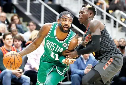  ?? AP FOTO / DAVID GOLDMAN ?? CAVS WHO. So far, Kyrie Irving’s decision to leave the Cleveland Cavaliers proves to be the right one as Boston now leads the league at 15-2, while the defending Eastern Conference champions are just two games above .500.