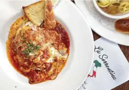  ??  ?? Beef, Italian sausage and three cheeses make up the lasagna at La Sorrentina Italian Restaurant on Culebra Road.