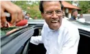  ??  ?? FLASHBACK TO HIS SMILING, SHINING HOUR: File photo of Maithripal­a Sirisena emerging from his car four years ago on November 20th in 2014 to announce his intention to contest the presidency as the UNP-led opposition’s common candidate