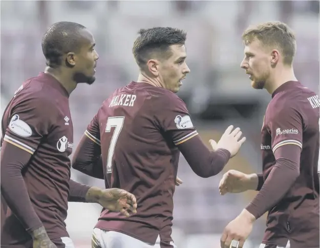  ??  ?? 0 Jamie Walker celebrates after making it 2-0 against Ayr as Hearts moved 15 points clear at the summit. Left, Craig Gordon kept a clean sheet on his 200th Hearts appearance