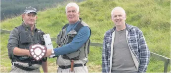  ??  ?? Runner-up Wullie Weir, left, is presented with his prizes by Tommy Morrison and Davy Learmonth after finishing second overall