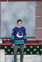  ??  ?? The Canadian Pres
Travis Hamonic poses for his team photo in Vancouver on Monday.