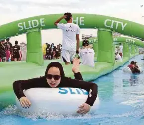  ?? FILE PIC ?? People having fun during the Slide the City event in Putrajaya in December 2015.