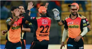  ?? — AFP ?? sunrisers Hyderabad players celebrate the dismissal of Kolkata Knight Riders’ Yusuf Pathan.