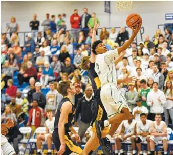  ?? STAFF PHOTOS BY TIM BARBER ?? East Hamilton’s Cameron Montgomery (2) breaks free for a layup in the second half against Walker Valley at Cleveland on Thursday night. Montgomery scored 21 points as East Hamilton won 63-57.