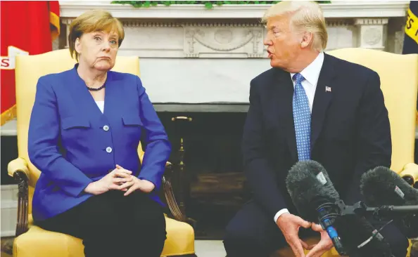  ?? EVAN VUCCI / THE ASSOCIATED PRESS FILES ?? U.S. President Donald Trump meets with German Chancellor Angela Merkel in the Oval Office of the White House in 2018.