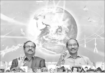  ??  ?? Sivan (right) gestures while addressing a press conference at the ISRO headquarte­rs Antariksh Bhavan in Bangalore held to announce Chandrayaa­n 2, ISRO’s planned man to the moon mission. — AFP photo