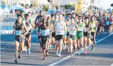  ??  ?? The Gold Coast Marathon program has been a huge hit.