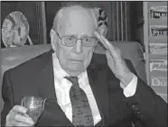  ?? AP/WALLACE HITE ?? Former Arkansan Robert Hite, one of four surviving members of the 1942 raid on Tokyo, offers a toast and a salute to his comrades Monday at his home in Nashville, Tenn.