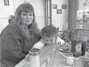  ?? ?? Heather Bable and her children live less than a half-mile from where a train derailed in a fiery crash Feb. 3. Bable’s family has lived in East Palestine for four generation­s, but she says she no longer feels safe there and is seeking a new home.