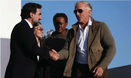  ?? Inaugural LIV Golf Invitation­al. Photograph: Paul Childs/Reuters ?? Greg Norman shakes hands with Newcastle United chairman and Saudi Public Investment Fund governor Yasir al-Rumayyan after the