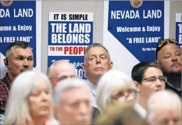  ?? Cathleen Allison
Associated Press ?? CLIVEN BUNDY , center, who has long battled the U.S. Bureau of Land Management over grazing rights, joins others at the Nevada Capitol in support of a bill that would challenge federal authority on public lands.