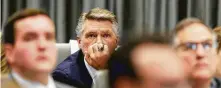  ??  ?? GOP candidate Mark Harris, who leads his congressio­nal race by 905 votes, listens as allegation­s of election fraud came to the fore.