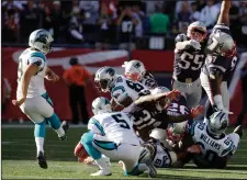  ?? AP PHOTO/CHARLES KRUPA ?? Carolina Panthers kicker Graham Gano, left, kicks the game-winning field goal as Michael Palardy (5) holds at the end of an NFL football game against the New England Patriots, Sunda, in Foxborough, Mass. The Panthers won 33-30.