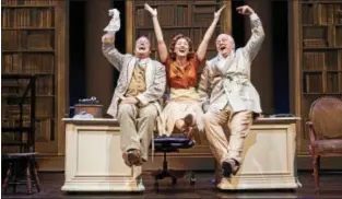  ?? ROGER MASTROIANN­I ?? Tom Ford, left, as Henry Higgins, left, Jillian Kates, as Eliza, and Aled Davies, as Colonel Pickering, appear in a scene from the Great Lakes Theater production of “My Fair Lady.”