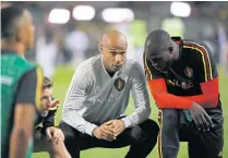  ??  ?? Belgium striker Romelu Lukaku, right, listens to assistant coach Thierry Henry before the match against Switzerlan­d.