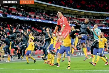  ?? AP ?? Juventus players celebrate at the end of their Champions League pre-quarterfin­al second leg match against Tottenham Hotspur at Wembley in London on Wednesday. Juventus won 2-1 to advance 4-3 on aggregate. —