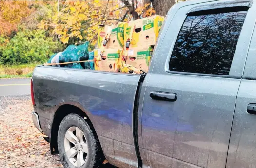  ?? CONTRIBUTE­D ?? A truckload of produce is loaded for delivery by one of the volunteers with the Annapolis Valley Frugal Moms Society.