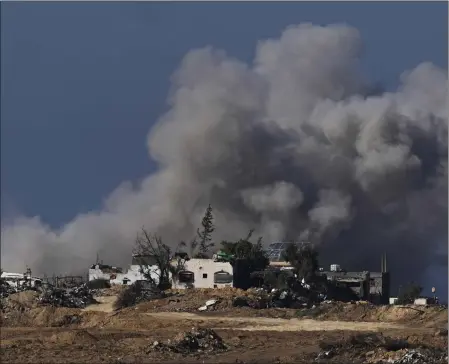  ?? OHAD ZWIGENBERG — THE ASSOCIATED PRESS ?? Smoke rises following an Israeli bombardmen­t in the Gaza Strip, as seen from southern Israel on Sunday. Israeli military leaders said they have largely wrapped up major operations in northern Gaza.
