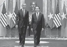  ?? CAROLYN KASTER, AP ?? President Obama and Vietnamese President Tran Dai Quang in Hanoi on Monday. The communist nation is ranked as corrupt.