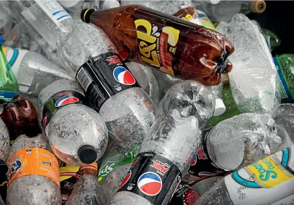  ?? GRANT MATTHEW/STUFF ?? With China’s ban on importing plastic for recycling, huge numbers of ‘‘recycled’’ bottles are now being stockpiled around the world.