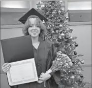  ?? Contribute­d ?? YSA graduate Caite Castillo, of Rome, moments after receiving her GED diploma on Tuesday, Dec. 7, at GNTC’s Floyd County Campus.