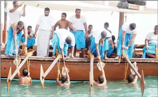  ??  ?? Youths reviving Kuwait’s old tradition of pearl diving.