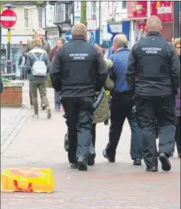  ?? Picture: Andy Clark ?? Litter enforcemen­t officers were seen walking past rubbish in Ashford town centre