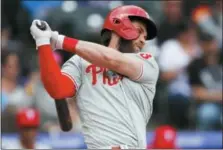  ?? DAVID ZALUBOWSKI — THE ASSOCIATED PRESS ?? Philadelph­ia Phillies’ Bryce Harper strikes out against Colorado Rockies starting pitcher Jon Gray in the fourth inning of a baseball game Sunday in Denver.