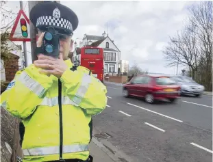  ??  ?? Crackdown: A cardboard cut-out cop used in a Fife speed campaign in 2016