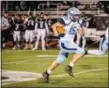  ?? JAMES BEAVER — FOR DIGITAL FIRST MEDIA ?? North Penn’s RJ Macnamara (15) breaks free for a long touchdown run in the first quarter against William Tennent last Friday. The Knights open the District 1-6A playoffs hosting Ridley tonight at Wissahicko­n.