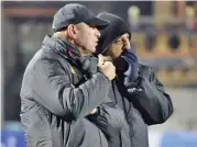  ??  ?? Oman coach Pim Verbeek (left) and his assistant Muhanna Said al Adawi watch the team’s training session on Monday