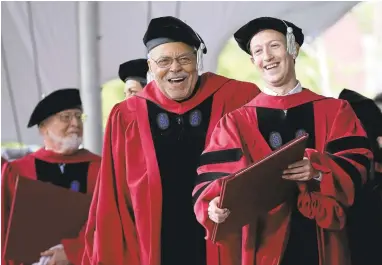  ?? STEVEN SENNE/ASSOCIATED PRESS PHOTOS ?? Actor James Earl Jones, center, laughs with Facebook CEO and Harvard dropout Mark Zuckerberg, right, during Harvard University commenceme­nt exercises on Thursday in Cambridge, Massachuse­tts.