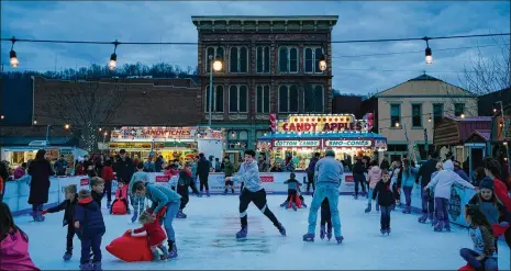  ?? ALYSSA SCHUKAR PHOTOS / THE NEW YORK TIMES ?? Downtown ice skating in Portsmouth, long known as ground zero in the state’s opioid epidemic, Dec. 22. Of the 394 children in this county removed from their homes last year, 47% were placed in kinship care.