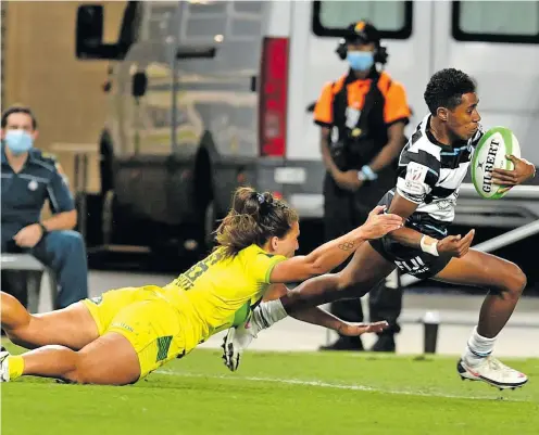  ?? Photo: Oceania Rugby ?? Team Fiji women’s rugby sevens halfback Reapi Uluinasau on her way to score against Australia at the Queensland Country Bank Stadium in Townsville on June 26, 2021.