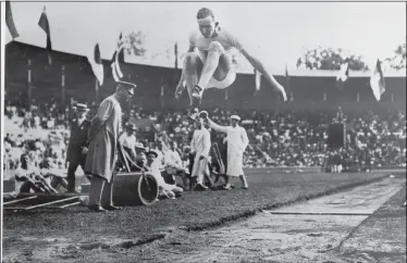  ?? PRESSENS BILD — THE ASSOCIATED PRESS ?? Albert Gutterson of the United States competes in the long jump at the 1912Olympi­c Games in Stockholm. Gutterson went on to win the gold.