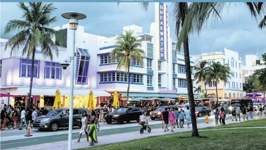  ?? DANIEL A. VARELA dvarela@miamiheral­d.com ?? Local residents and tourists enjoy a stroll down Ocean Drive in May during Memorial Day weekend in Miami Beach. Tourism officials are just as ebullient about visitors to other Miami-Dade neighborho­ods, such as Wynwood, Coconut Grove, Allapattah, Homestead and Coral Gables. Each has many hotels, restaurant­s and other venues.