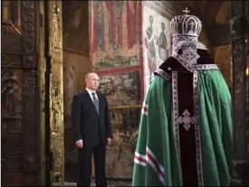  ??  ?? Russian President Vladimir Putin attends a service held by Russian Orthodox Patriarch Krill (right) in the Annunciati­on Cathedral after the inaugurati­on ceremony in the Kremlin in Moscow. AlexeI NIkolsky, PuTNIk, kreMlIN Pool PhoTo VIA AP
