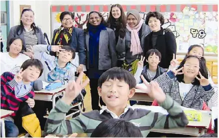  ??  ?? Top performing teachers from Sri Bestari visited several schools in South Korea.