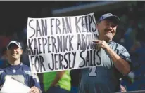  ?? Associated Press ?? n LEFT: From left, San Francisco 49ers outside linebacker Eli Harold, quarterbac­k Colin Kaepernick, center, and safety Eric Reid kneel during the national anthem Oct. 2, 2016, before an NFL football game against the Dallas Cowboys in Santa Clara,...